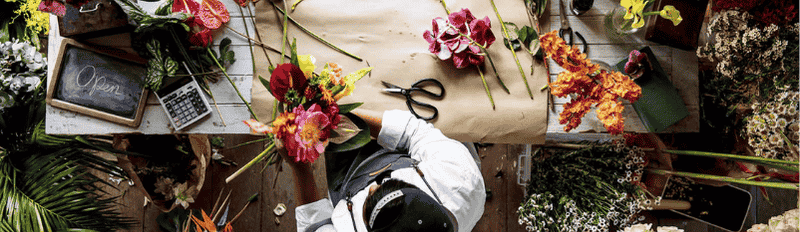 worker making flower bouquet 