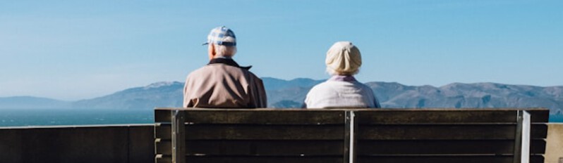 man and woman on bench