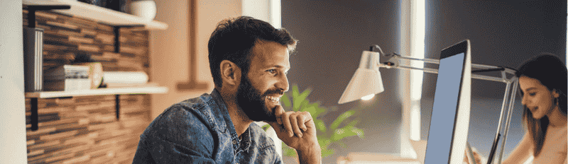 man on desktop computer