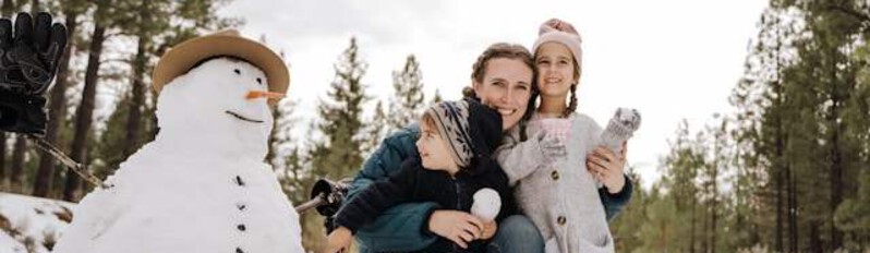 family building a snowman